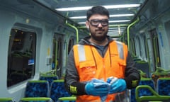 Fawad, 33, cleans a Melbourne train at the Craigieburn train maintenance facility