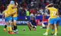 Uruguay players celebrate their victory over Namibia at the final whistle whilst the Namibians look dejected.