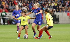 USA midfielder Lindsey Horan (10) tries to dribble past Colombia midfielder Leicy Santos (10) and midfielder Lorena Bedoya (5) during the first half on Thursday at America First Field.