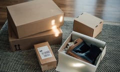 boxes including shoes laid out on the floor of a lounge