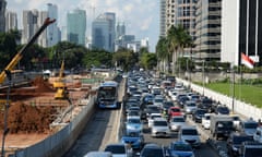 Cars stuck in macet (gridlock) as work continues on Jakarta’s metro system and a BRT bus enjoys a stretch of dedicated lane.