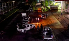 MEXICO-CRIME-VIOLENCE-POLICE<br>Policemen work at a crime scene after a colleague was killed in Acapulco on July 23, 2018. - Mexican President-elect Andres Manuel Lopez Obrador, who will take office on December 1, 2018 inherits a messy war on drug cartels from his predecessor Enrique Pena Nieto. Since Mexico deployed its army to fight drug trafficking in 2006 during the presidency of Felipe Calderon, the country has been engulfed in a wave of violence that has left more than 200,000 murders, 30,000 missing, as well as complaints against the heavily armed security forces for violations, extrajudicial executions and forced disappearances. (Photo by FRANCISCO ROBLES / AFP) (Photo credit should read FRANCISCO ROBLES/AFP via Getty Images)