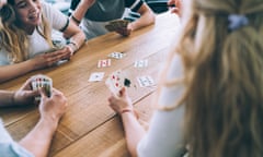 Young people playing cards (posed my models)