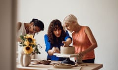 Kalpana Mehta, Katja Špiler and Liz Boulter with a pot on a small wheel in Katja's studio in Križe, Slovenia