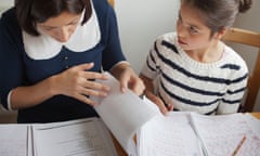 Tutor teaching private lessons to a young child.