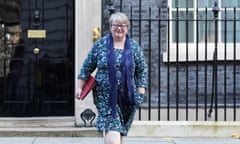 Thérèse Coffey walking from 10 Downing Street towards the camera wearing a floral dress