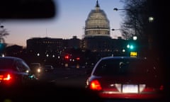 The US Capitol Building Dome before sunrise, as seen from a taxi, in Washington DC