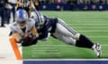 Detroit’s Amon-Ra St Brown scores a touchdown against Stephon Gilmore of the Cowboys during the fourth quarter of Saturday’s game in Arlington, Texas.