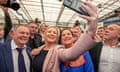 TOPSHOT-BRITAIN-NIRELAND-ELECTION-POLITICS<br>TOPSHOT - Deputy First Minister of Northern Ireland and Irish republican Sinn Fein party member Michelle O'Neill (centre L) takes a selfie photograph with Sinn Fein party President Mary Lou McDonald (centre R) as they arrive at the Magherafelt Meadowbank sports centre in Magherafelt, Co Londonderry, on May 7, 2022. - Northern Ireland on Saturday resumed counting ballots from an election that has put the nationalist Sinn Fein party on course for a historic victory. As the count restarted from Thursday's complex proportional voting, the former political wing of the IRA paramilitary group had secured 18 seats for the 90-seat legislature. (Photo by Paul Faith / AFP) (Photo by PAUL FAITH/AFP via Getty Images)