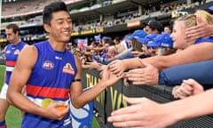 Lin Jong of the Bulldogs celebrates with fans, after the side's win in the round 2 AFL match between the Richmond Tigers and the Western Bulldogs, at the MCG in Melbourne, Saturday April 11, 2015. (AAP Image/Joe Castro) NO ARCHIVING, EDITORIAL USE ONLY