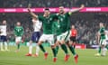 Republic of Ireland’s defenders John Egan (L) and Shane Duffy (2L) celebrate after Serbia’s defender Nikola Milenkovic scored an own goal.