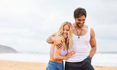 Man and woman walking along a beach