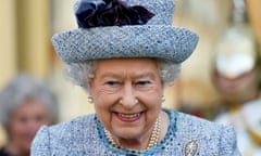 A head and shoulders of the Queen in a pale blue hat and suit, smiling