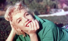 Marilyn Portrait<br>PALM SPRINGS, CA - 1954: Actress Marilyn Monroe poses for a portrait laying on the grass in 1954 in Palm Springs, California. (Photo by Baron/Getty Images)
