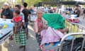 People wait for treatment outside a hospital in northern Lombok