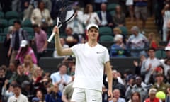 Jannik Sinner salutes the crowd as he celebrates after winning his first round match against Yannick Hanfmann.