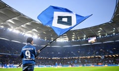 Hamburger SV v 1. FC Magdeburg - Second Bundesliga<br>HAMBURG, GERMANY - APRIL 08: A Hamburg supporter waves a flag prior to the Second Bundesliga match between Hamburger SV and 1. FC Magdeburg at Volksparkstadion on April 08, 2019 in Hamburg, Germany. (Photo by Stuart Franklin/Bongarts/Getty Images)