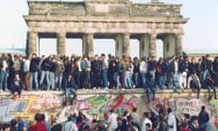 A protest on top of the wall on the eve of its demolition.