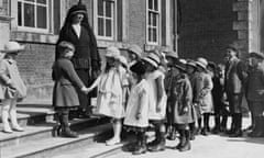 Convent school pupils queue to wish one of their classmates happy birthday.