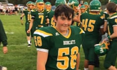 Michael Shuls in his green and yellow American football kit on the pitch with his team