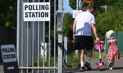 A man and a child arrive at a polling station in Hillingdon, north-west London, for a byelection in July