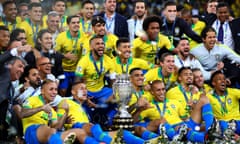 Brazil celebrate with the trophy following the Copa América final against Peru.