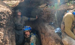 Still from film Real of Ukrainian soldiers in unifrom and helmets in a trench