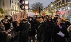 Chinese people at a protest march outside the Chinese embassy in London