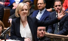 Liz Truss raises her left hand while speaking during prime minister's questions in the Commons