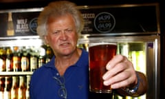 Wetherspoon's boss Tim Martin with a pint of beer in one of the company's pubs