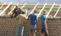 Students building a greenhouse in India