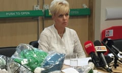 PSNI DS Karen Baxter displays some of the weapons found during the searches as she speaks to the media.