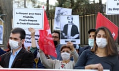 Demonstrators outside the French embassy  in Ankara. A sign reads ‘Respect for our prophet is respect for all mankind.