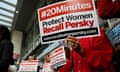 Activists hold signs calling for the removal of Judge Aaron Persky from the bench after his controversial sentencing in the Stanford rape case, in San Francisco, California, U.S. June 10, 2016. REUTERS/Stephen Lam