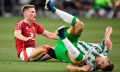 Scott McTominay takes a seat as a Real Betis opponent goes tumbling after the Manchester United player’s shot in the US friendly.