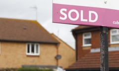 An estate agent’s ‘sold’ sign outside a property