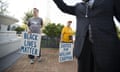 Steve Baggarly, Elisa Dickon, and Bishop Kendrick J. Turner all of Norfolk stand outside the Portsmouth Judicial Center, in Portsmouth, Va., Wednesday, July 27, 2016, as they wait for others to arrive for a rally in support of William Chapman II who was shot by Portsmouth police officer Stephen Rankin outside a Portsmouth Wal-Mart last year. The murder trial of Rankin begins this morning. (Bill Tiernan/The Virginian-Pilot via AP)