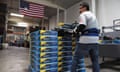 A worker stacks packaged bed frames in a factory in Commerce, California, in 2017. US manufacturing data suggested the world’s biggest economy may be slowing.