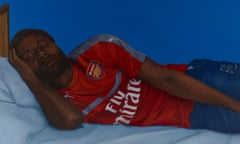 Painting, called Lying by the artist Catherine Chambers, shows a man lying on a bed in an Arsenal shirt and jeans.