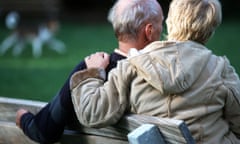 Man and woman sitting on park bench