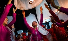 MYANMAR-RELIGION-CEREMONY-OFFBEAT<br>In this picture taken on March 31, 2019, devotees release lanterns near a makeshift palace during abbot Kay Lar Tha’s funeral in Mudon, Mon State. - Thousands of devotees flocked to a mock palace of kaleidoscopic colours in southern Myanmar this week to dance, sing and pay their final respects at the lavish cremation of a local celebrity monk. Abbot Kay Lar Tha was just 48 when he died last year from leukemia in Mudon village in eastern Mon State. It took his faithful followers nine months to raise the $80,000 needed for the extravagant cremation -- a fortune in one of Asia’s poorest countries, where a third of people live in poverty. (Photo by Ye Aung THU / AFP)YE AUNG THU/AFP/Getty Images
