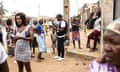 Angolan people line up outside voting station to cast ballot