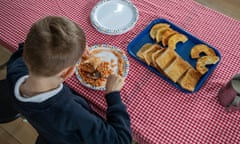 A pupil tucks in at The Priory primary school in Wednesbury, West Midlands. 