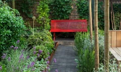 view along path to red garden bench