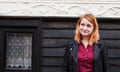 Woman standing in front of house