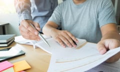 Teacher helps a teenage student revise