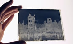 Glass plate negative (held over light box) showing the ruins of Patrick Street, Cork. GNM Archive ref: WHD/1/12 Photograph: Walter Doughty for the Guardian