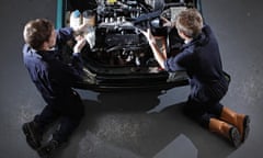 BTec students work on a car engine