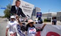 People in pro-RFK Jr shirts and signs saying 'Let Kennedy debate!'