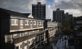 Children play in front of their homes on the Falinge estate in Rochdale, England